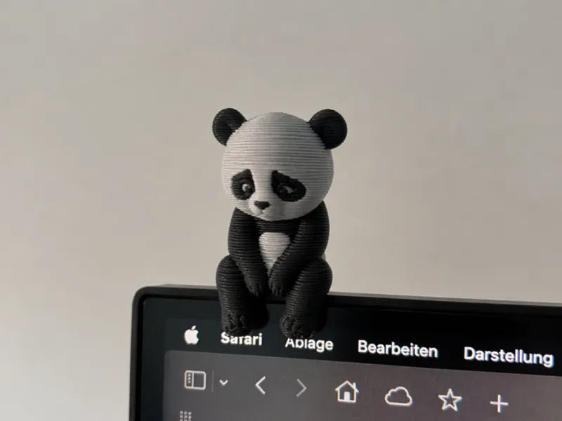 Sad Panda Sitting on Monitor Edge  shelf